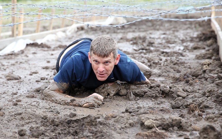 Ron Miller makes his way through the mud pit at the 2nd Annual Mudd, Sweat, and Tears obstacle race that took place on Saturday at Otway Nordic Centre. Citizen Photo by James Doyle June 11, 2016