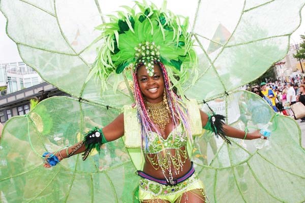 Brightly colored and elaborate costumes are all part of the Annual Caribbean festival parade as it makes it's way down Lonsdale.