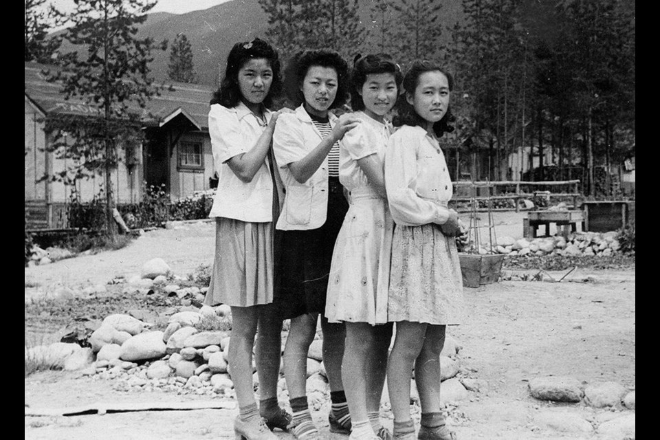 Friends of Michiko (Midge) Ayukawa pose at the Lemon Creek internment camp in the Slocan Valley. Photograph courtesy George Metcalf Archival Collection, Canadian War Museum