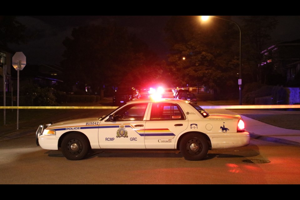 Police on scene of a shooting in the 3900 block of Forest Street on Monday night. A 29-year-old Coquitlam man was gunned down and later died in hospital after an altercation with somebody driving a dark-coloured sedan.