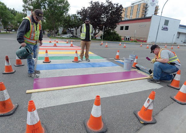 The crew from Yellowhead Pavement Marking puts the final colour of System 400 Cold Plastic on the rainbow cross walk on 7th Avenue at Qubec Street Tuesday afternoon. Citizen photo by Brent Braaten June 14 2016
