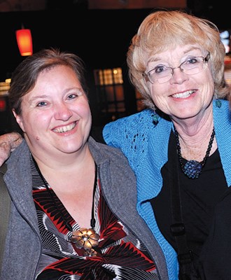 Gallery administrator Marina van den Berg and Joanne Waters flash their smiles.