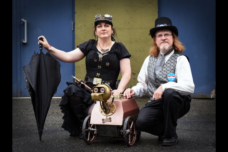 Times Past Entertainment founders Christina Carr and Martin Hunger pose with M.U.T. at the weekend’s sixth annual Vancouver Mini Maker Faire at the PNE Forum. Photograph by: Rebecca Blissett
