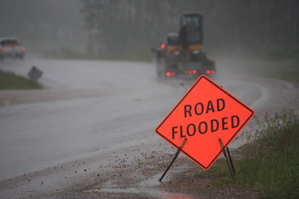 Highway 52, which connects Tumbler Ridge to Highway 97 and Dawson Creek, was down to one lane alternating traffic June 15 as overwhelmed ditches led to water crossing the road about 10 kilometers south of Arras.
