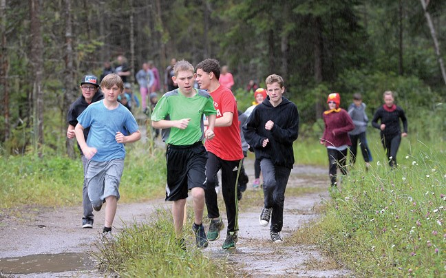 Running the trails from the start to the first obstacle during the first annual Canadian Tire Little Mudder at Otway Thursday. Citizen photo by Brent Braaten June 16 2016