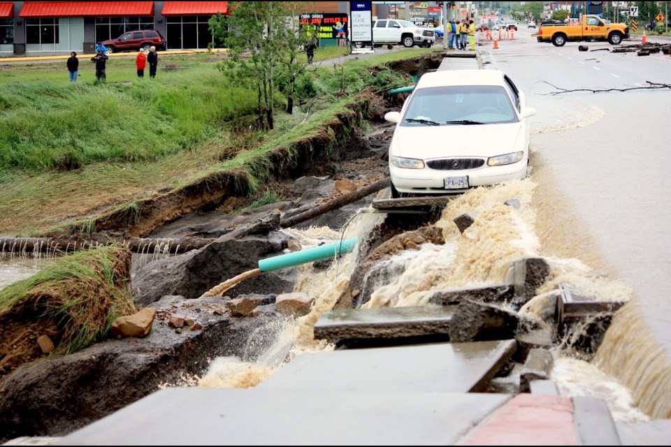 A white Buick caught in flood waters on 8th Street has become an iconic image of the Dawson Creek floods.