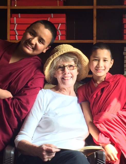 Caroline Orr with young monks who call her "Momo" which means "Grandma."