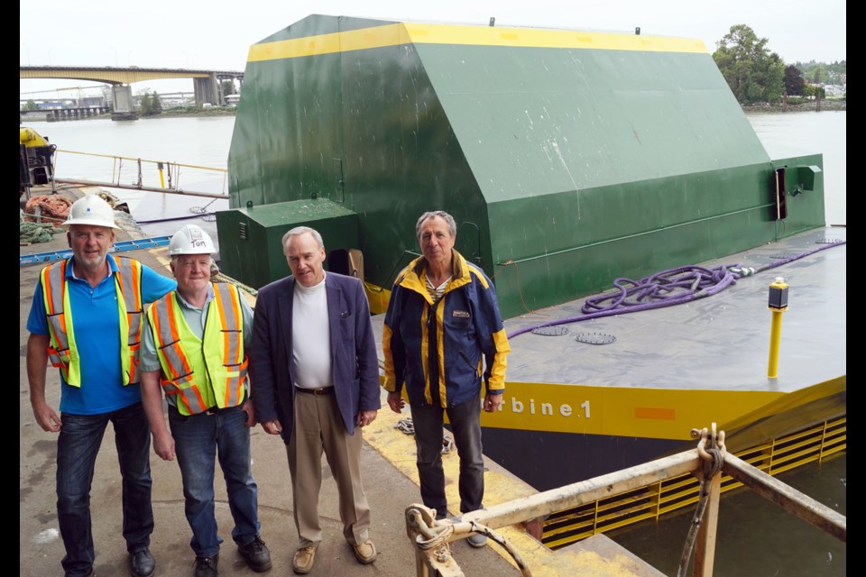 Fom left to right are Meridian Marine Industries owners Jim McFadden and Tom Ferns, alongside Water Wall Turbine executives Russ Baker and Marek Sredzki. The quartet represent a joint business venture to build portable tidal energy vessels for remote places along B.C.’s West Coast. The vessel behind them is the first prototype and could be fitted with turbines to produce one megawatt of power during peak loads. The devices could eliminate fossil fuel shipments inside narrow channels. Right photo, a Meridian employee welds inside the covered shipyard bay.