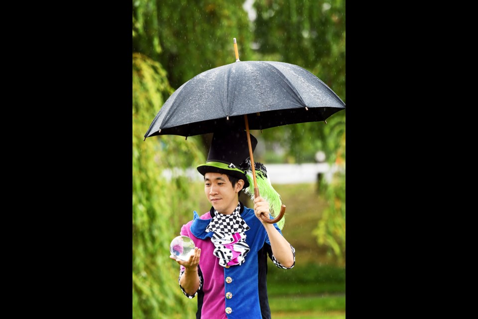 Nigel Wakita of the Vancouver Circus School performs in the rain at last year's Queensborough Children's Festival. This year's festival is on Saturday.