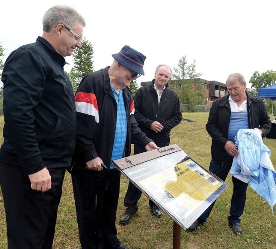 Mayor Lyn Hall, family member Bev Foot, Ron Fisher, Husky Energy and family member Howard Foot look at the interpretive sign unveiled in Foot Park Wednesday morning.