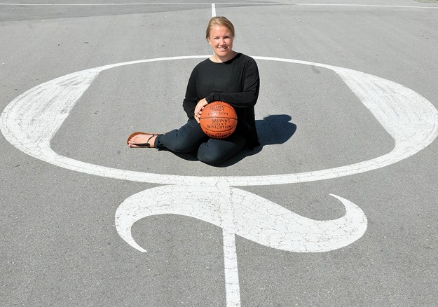 Jamie Keast finds peace on the Q court at North Vancouver’s Queen Mary elementary. The court is one of three built around the Lower Mainland in honour of Jamie’s twin brother Quinn, a beloved high school athlete who was killed in a pedestrian accident 10 years ago this month. photo by Paul McGrath, North Shore News