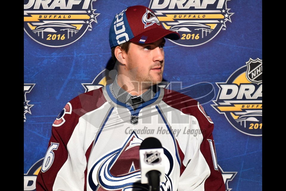 Prince George Cougars defenceman Josh Anderson sports his new jersey and hat after the Colorado Avalanche picked him in the third round, 71st overall in the NHL draft Saturday in Buffalo, N.Y.