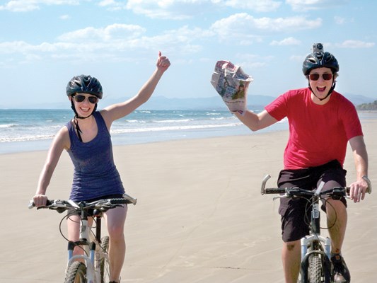 Jessica Stewart and Darcy McGilvery take the North Shore News for a ride on the beach in Mal Pais, Costa Rica, while on a bike adventure tour.