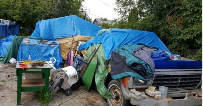 Council unanimously supported remedial action on this Spruce Street home. Garbage has piled up in the backyard, this May 30 image shows.