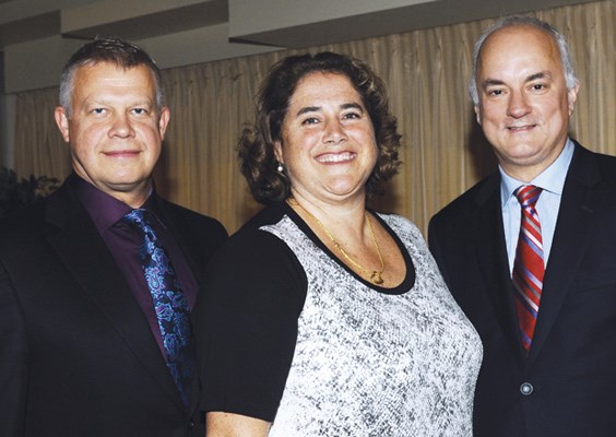 Head coach Janusz Kaczmarek, vice-president Kathryn Basran and president Carman Overholt