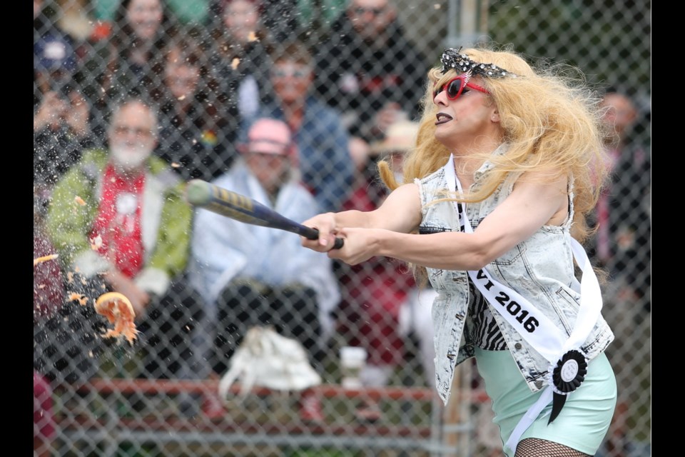 Ms Gay VI 2016 (Henrietta) blasts a grapefruit at the annual memorial dragball game at Vic West Park, part of Pride Week.