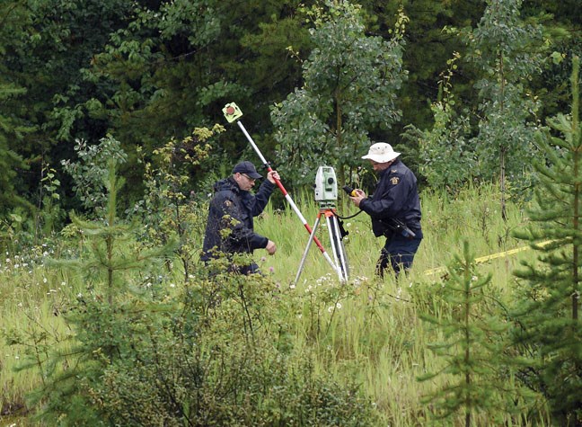 RCMP set up a transit at the location along Highway 97 where a body was found Sunday.