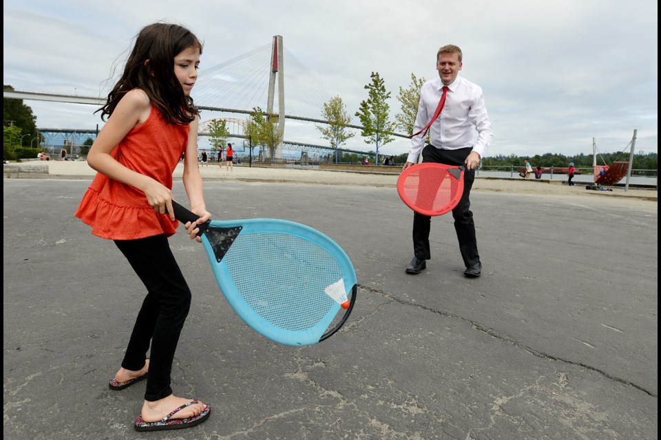 Ready to play: Mayor Jonathan Cote and daughter Renee play with items from the new Playbox at Westminster Pier Park. The box contains all sorts of items for park goers to use.