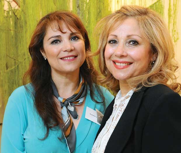 Artists Reyhaneh Bakhtiari and Guity Adib check out the exhibited works of art.