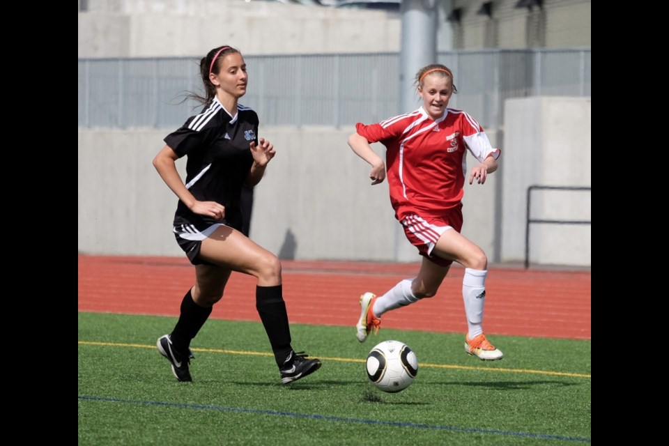 Burnaby Central's Reesa Wright, at right, during a Burnaby-New West league soccer game.