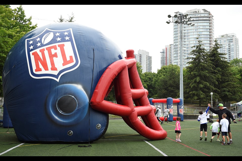 Kids from across Vancouver got a chance to kick, catch and kibitz with the pros this week at a football camp at Andy Livingston Park Field.