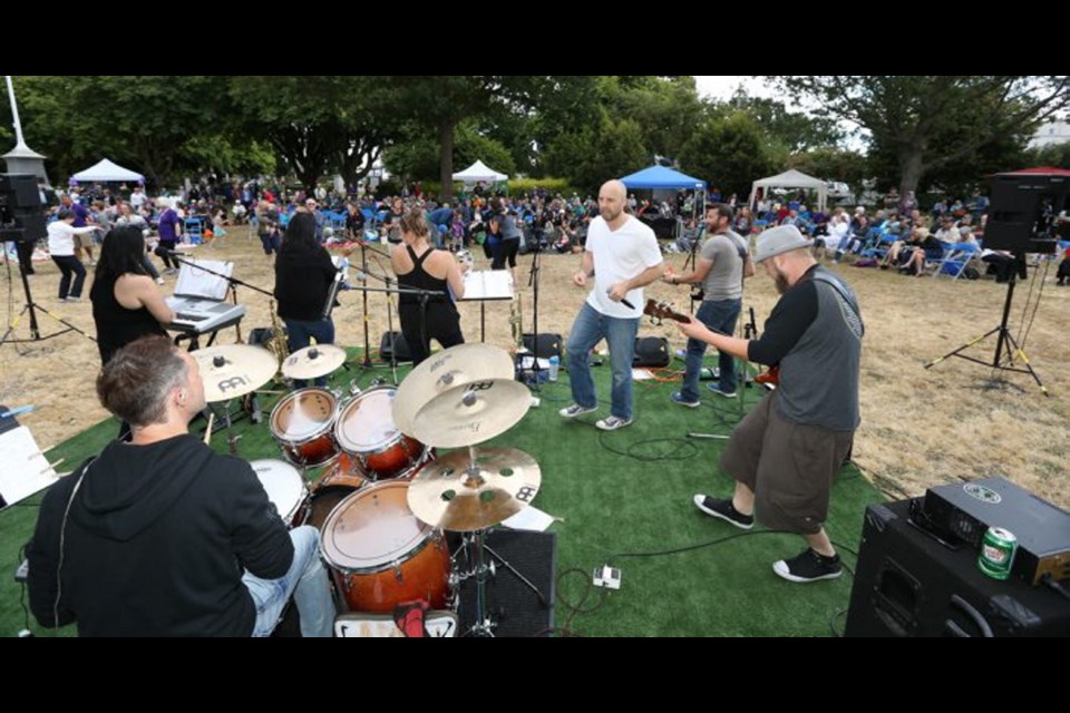 Bobby Dazzler, a band featuring three local music teachers, lit up the crowd at Esquimalt&Iacute;s Memorial Park on Tuesday.