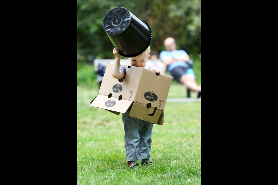 Two-year-old Hart Renforth pretends to be a robot at the Spare Parts Pop-Up Adventure Playground at Tipperary Park on Sunday.