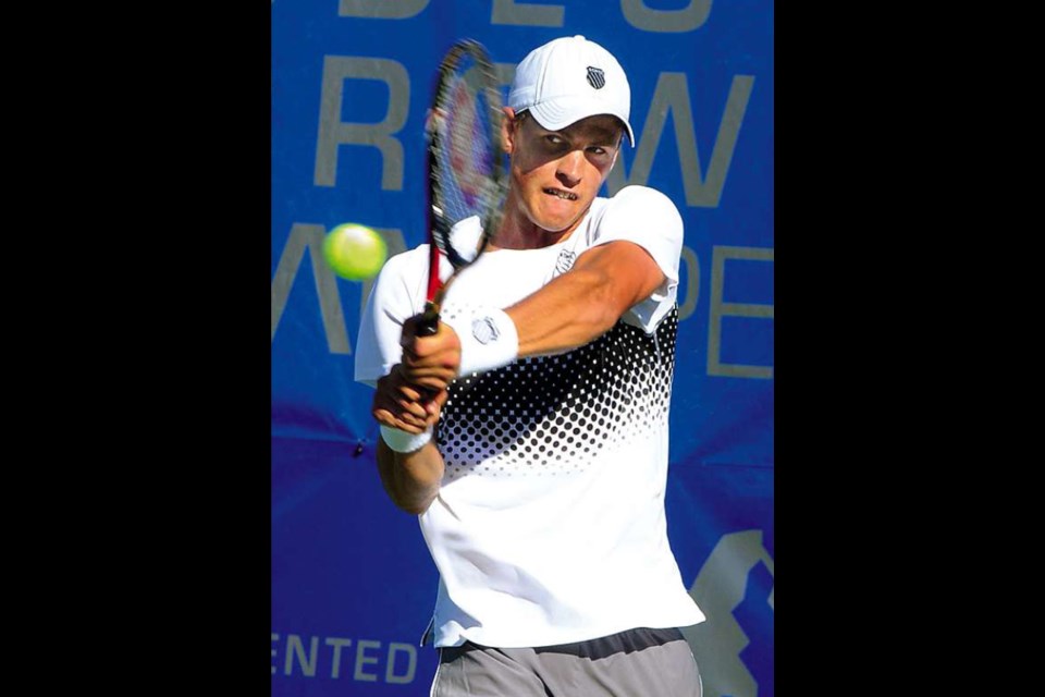 CANADA's Vasek Pospisil returns on the backhand against American Bradley Khan during play on Thursday at the Odlum Brown VanOpen. Pospisil won his battle at Hollyburn Country Club against Khan 7-6, 6-3 and was to play Roman Borvanov in the quarter finals Friday evening.