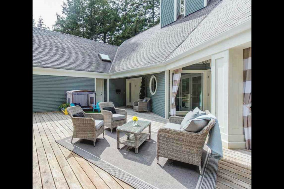 The new Cape Cod-style exterior was updated with Benjamin Moore paint in a shade called Piedmont Grey.