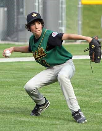 Forest hills pitcher Indigo Diaz lets one go but to no avail as Lynn Valley Little League squeaked by Forest Hills 2-1 in the championship game of the District 5 Majors tournament played at Chris Zuehlke Memorial Park on Monday.