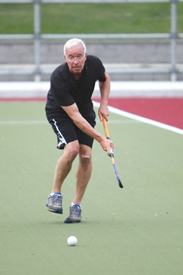 Vice-president Mike McKnight tracks the ball during the men's scrimmage at Rutledge Field.