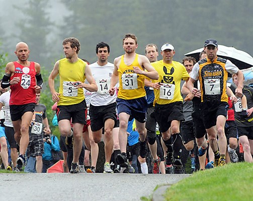The start of the "Red Bull Divide and Conquer" endurance race at Cleveland Park. The multi-sport fitness challenge features trail running, mountain biking and kayaking for the teams consisting of three athletes..