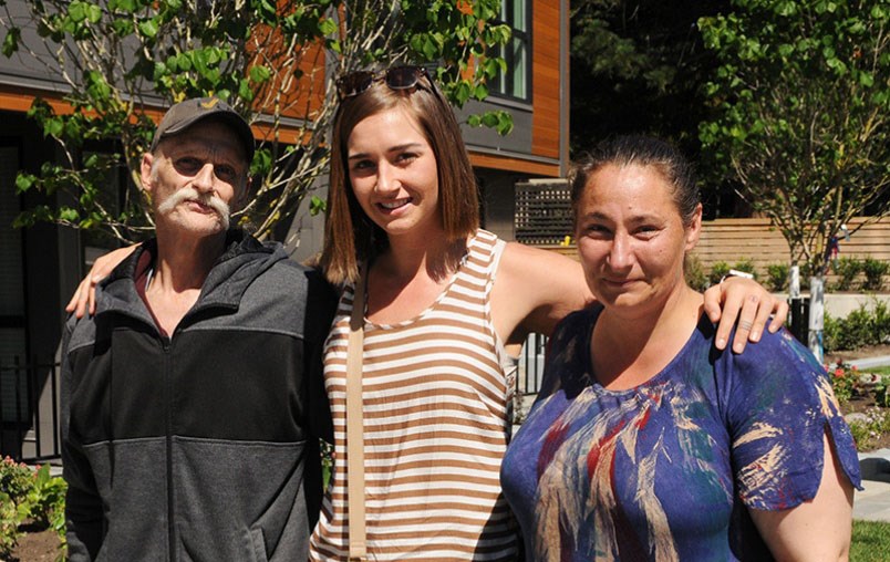 Spencer Clark (centre) hugs her "heroes" Eddie Van Loenen and Rachel Rathjen.