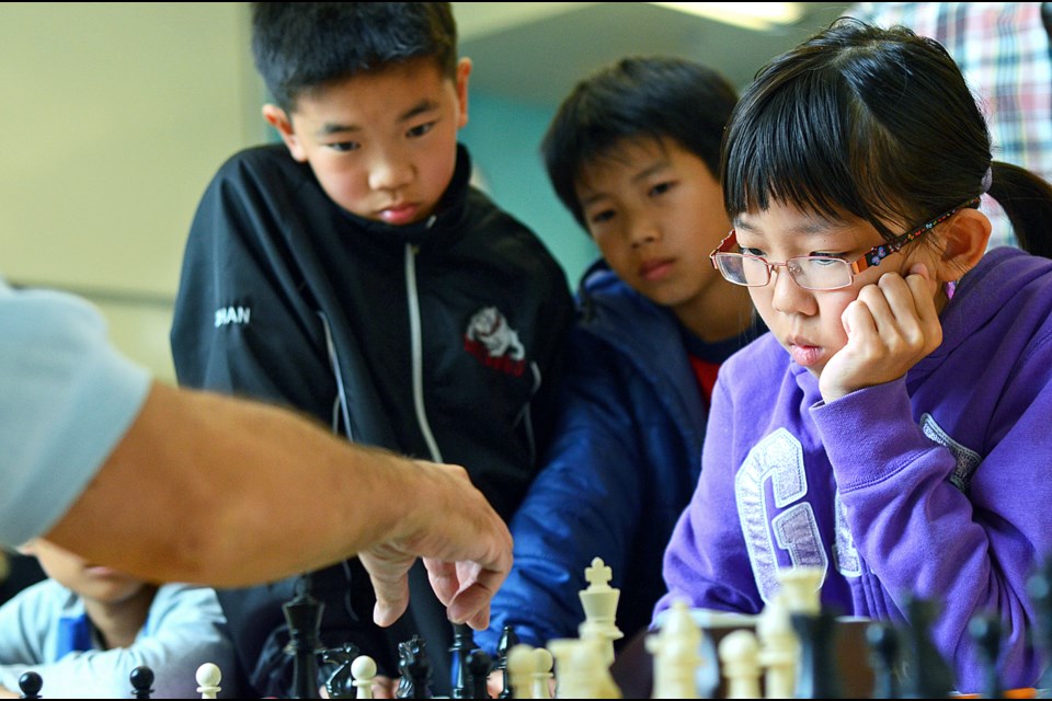 B.C. girls under-12 champion Sherry Tian ponders her next move at a recent youth chess tournament at Burnaby Public Library’s Tommy Douglas branch.