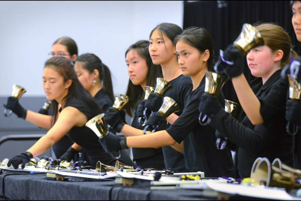 Members of Sound Wave, a Burnaby school district honours handbell ensemble, ring the processional at the 17th International Handbell Symposium in Vancouver Tuesday.