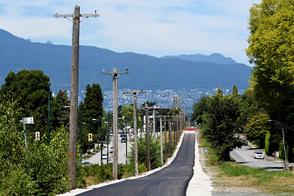 A temporary asphalt path is in the process of being put down along Arbutus corridor to encourage mor