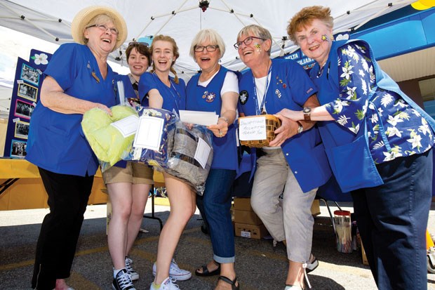 Delta Hospital Auxiliary volunteers and interns man the Discovery Day display outside the auxiliary’s thrift shop on Delta Street. Discovery Day, held July 24, gave the public a glimpse into the role the auxiliary plays at Delta Hospital and also offered a number of fun activities.