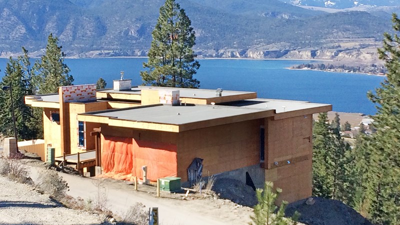 New lakeview house under construction at Naramata Beachlands near Penticton: local housing prices in the Okanagan are a fraction of those in the Lower Mainland.