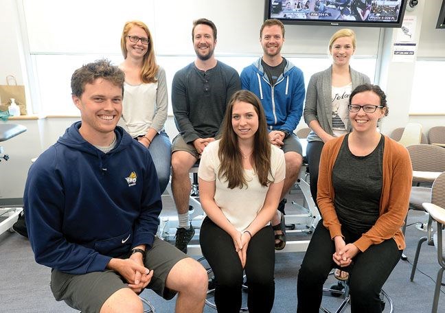 Physiothearpy students pose in the clinic at UNBC on July 21. From left to right, starting with the back row, are Saja Edwards, 25, Ryan Patterson, 26, Logan Ralph, 32, Michaela Toffoli, 27, Isaac Davies, 23, Tory Prentice, 24, and Carly Nicholson, 28.