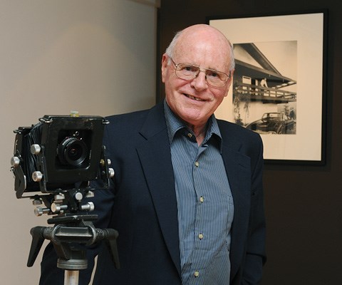 Featured photographer John Fulker displays the camera he used for many of his photographs.