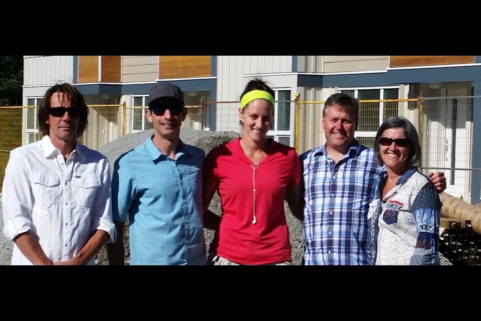 The Target Homes team including Dave Ransier (far right) and Maureen Mackell of Squamish Helping Hands Society. The company employs society clients, to great success, Ransier says.
