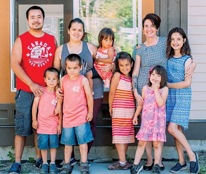 Ken and Rebecca Nelson and family and Zarah Gale and family outside their new homes at Habitat for Humanity Sunshine Coast Village in Wilson Creek.