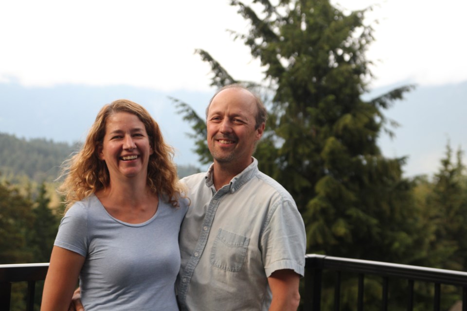 Kat and Cam Hayduk standing outside of the Common House at Belterra.