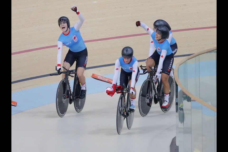 Members of Canada's team pursuit cycling team celebrate their bronze medal win Saturday at the Olympics in Rio.