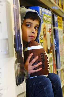 11-year-old Joey Sadain waits for the Grey Cup to arrive at Canadian Tire in North Vancouver.