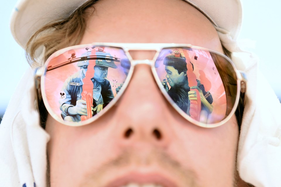 Artist Peter Ricq’s sunglasses reflect his mural called “Kids." Photo Dan Toulgoet