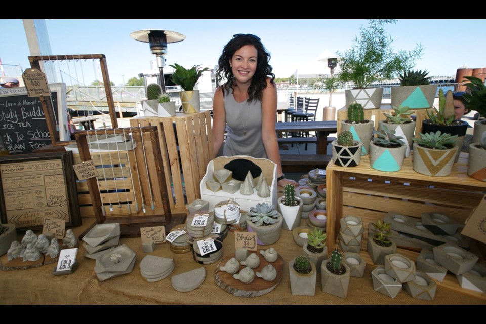 Nicole Portmann, owner-operator of Cold Gold, displays her line of jewelry and home decor crafted from concrete.