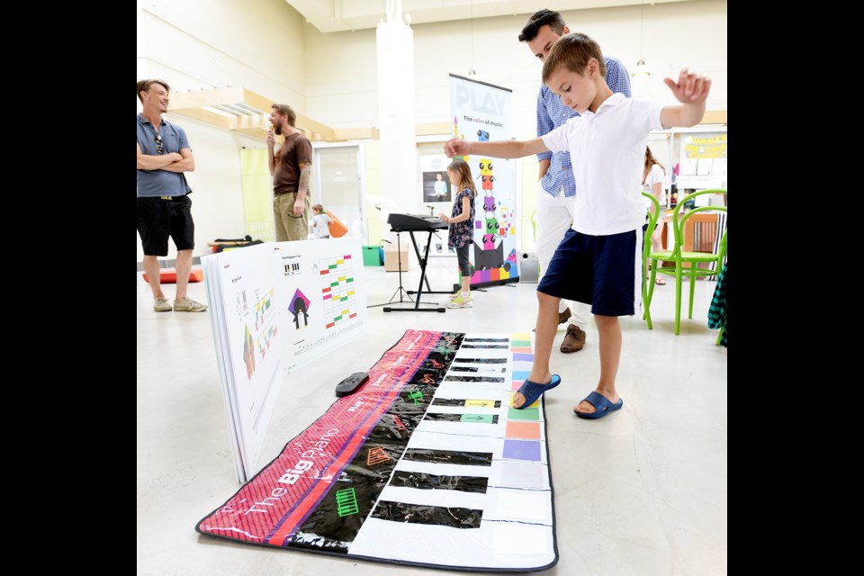 Playing with your feet was part of the fun during a piano afternoon at River Market.