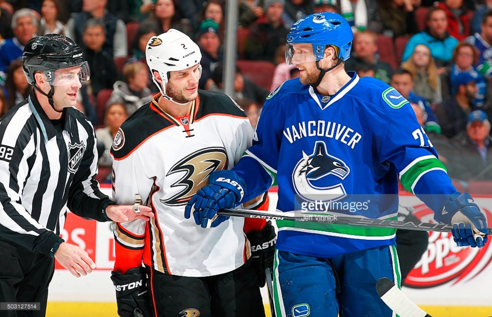 Alex Edler and Kevin Bieksa share a moment. It's a special moment.