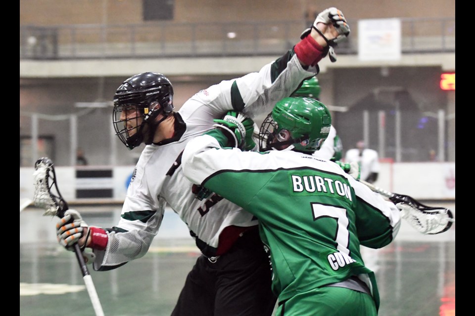 Burnaby's Tyler Digby, left, tries to elude the check of Victoria's Tyler Burton during Game 6 of their best-of-seven semifinal last Friday. The Lakers forced a Game 7, but fell to Victoria 14-11.